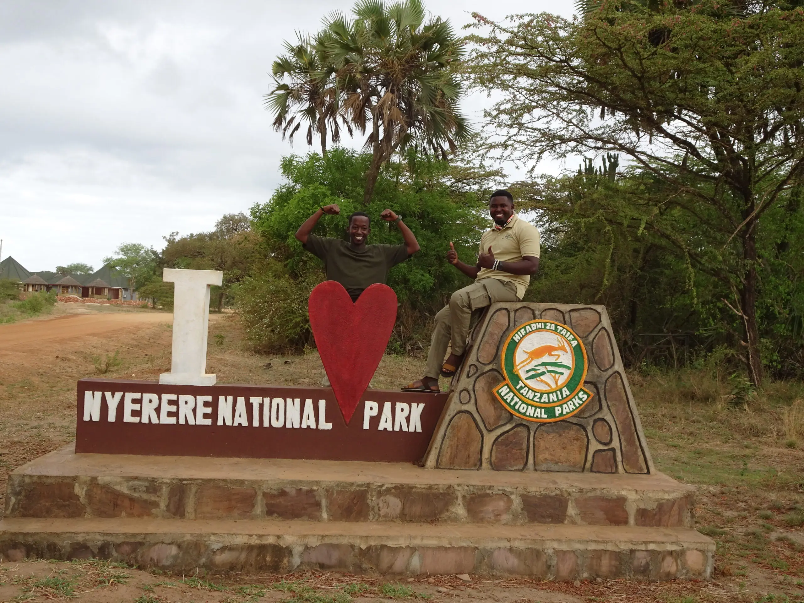 Two people posing at Nyerere National Park.