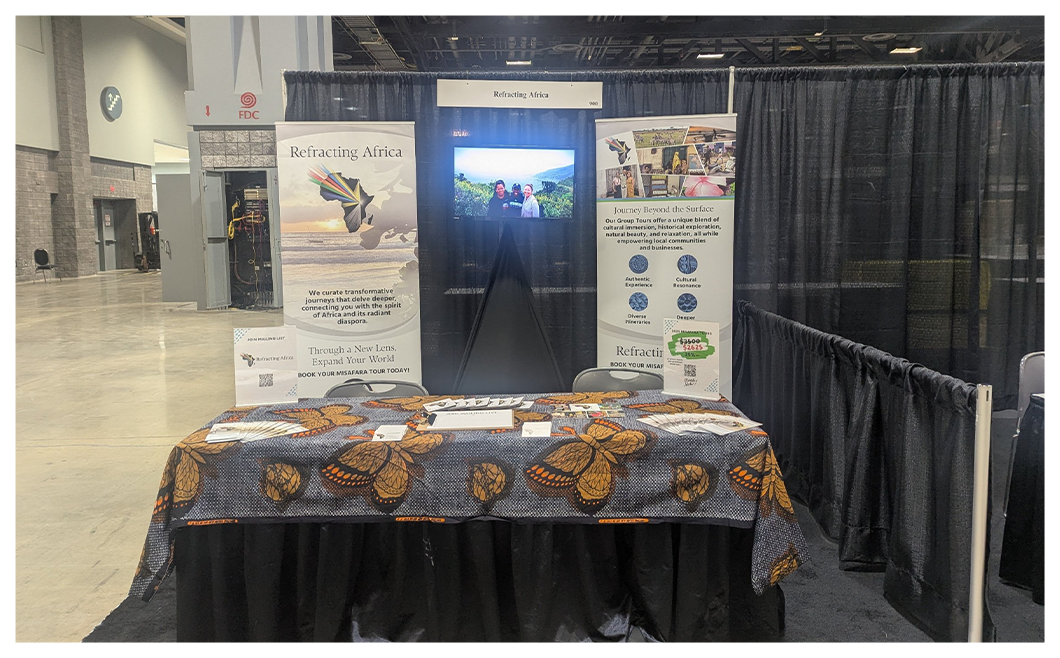 Exhibition booth with informational display and brochures.